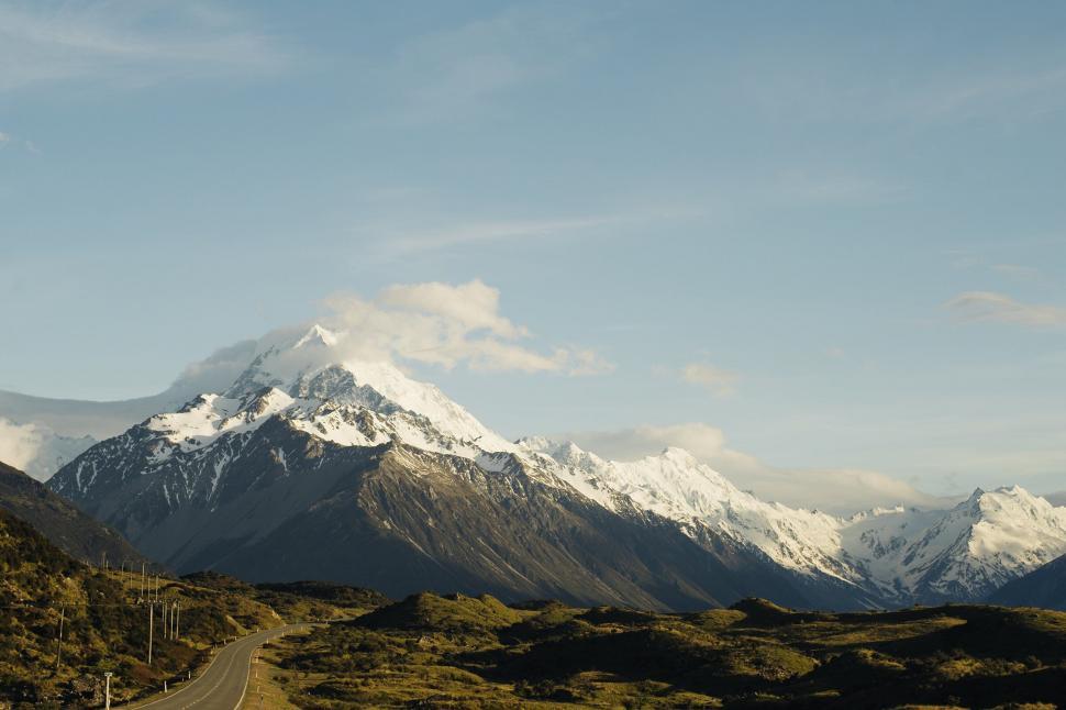 Free Image of Scenic view of a mountainous road at dusk 
