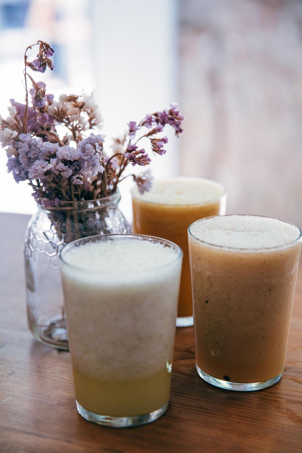 Free Image of Three glasses of organic smoothies on wood 