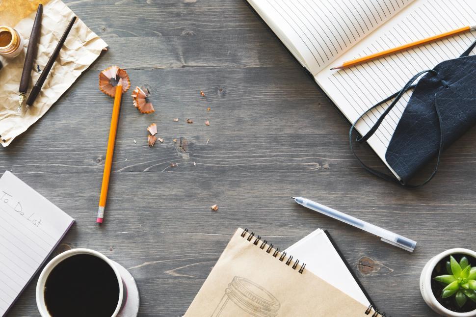 Free Image of Creative workspace with coffee and notebooks 