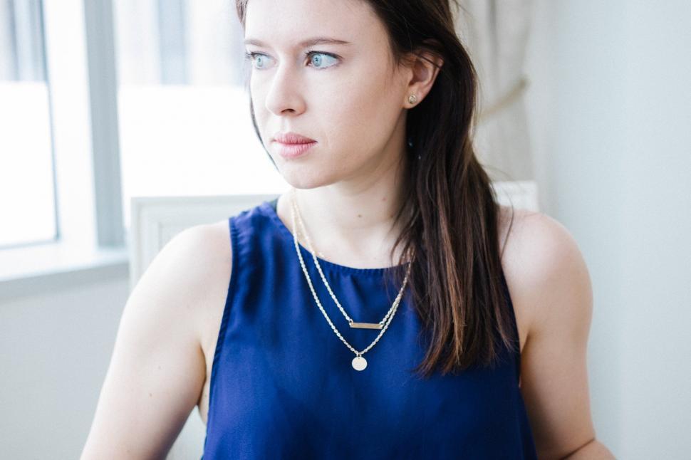 Free Image of Woman with thoughtful expression indoor 