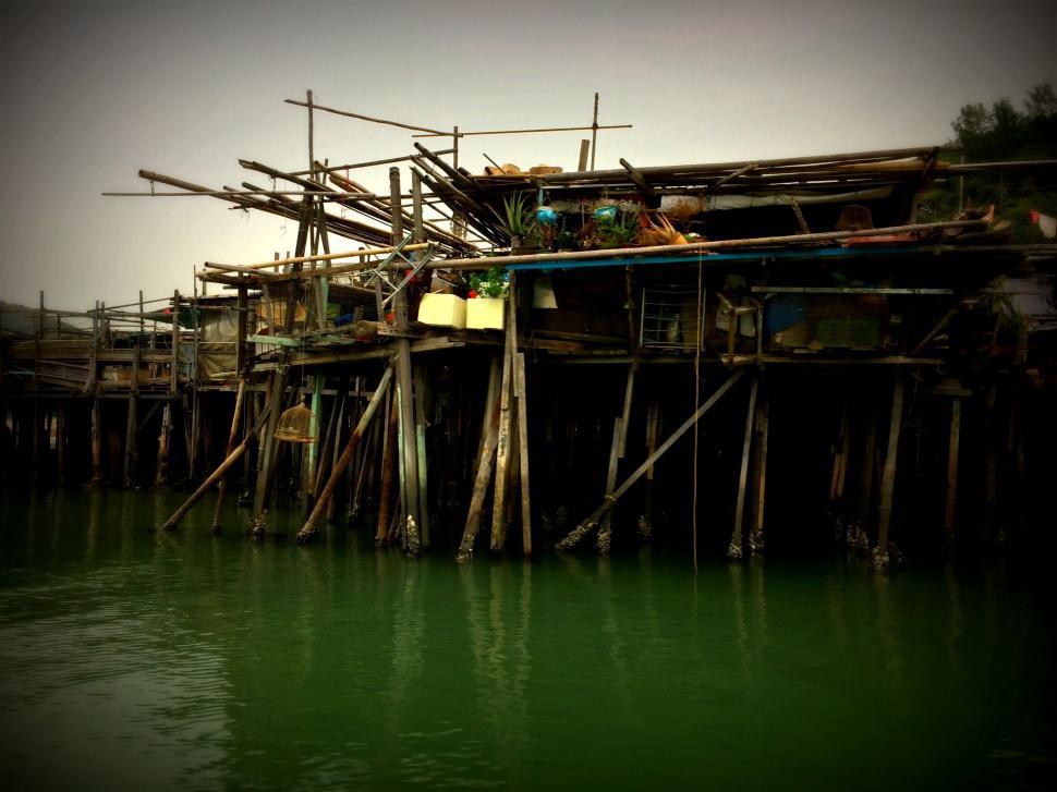 Free Image of Rustic stilt house over tranquil waters 
