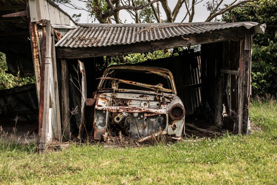 rusty-abandoned-car-in-a-dilapidated-shed.jpg