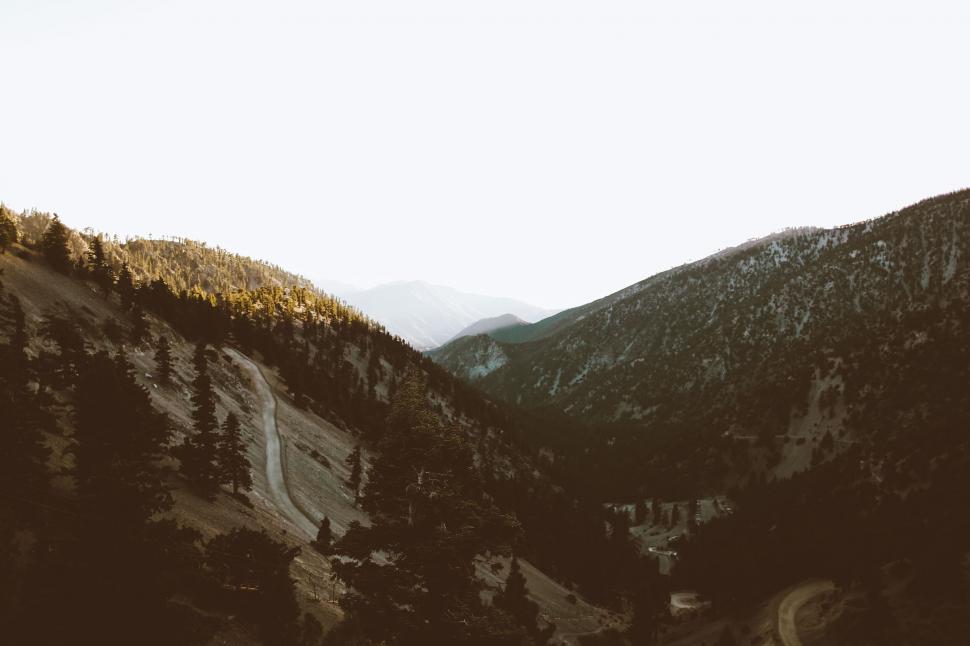 Free Image of Mountains basking in the sunset s golden light 