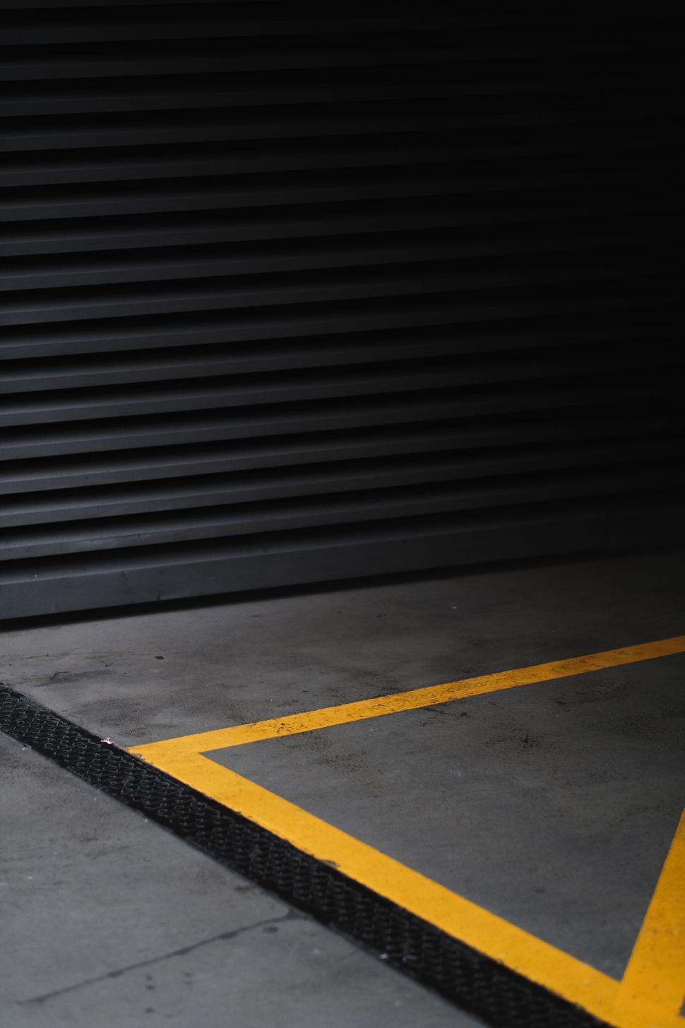 Free Image of Minimalistic urban street with yellow lines 