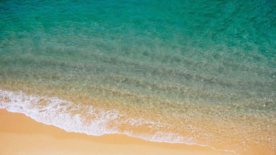 Free Image of Aerial view of beach shore and waves 