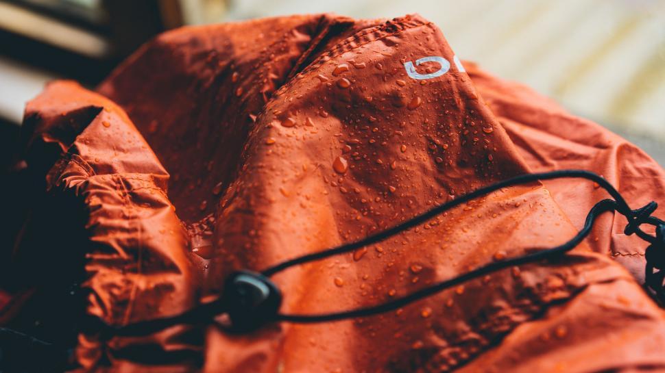 Water droplets on orange jacket