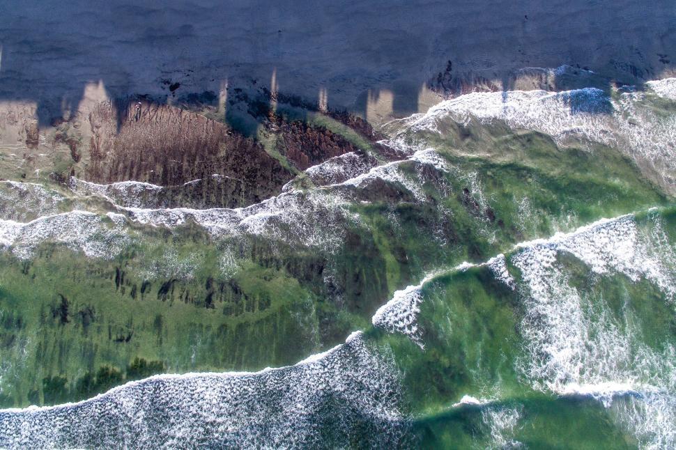 Free Image of Aerial view of ocean waves and beach 