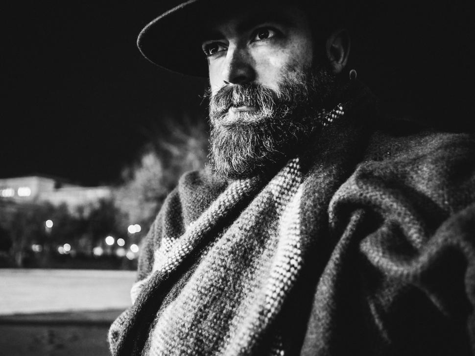Free Image of Black and white photo of man in hat 