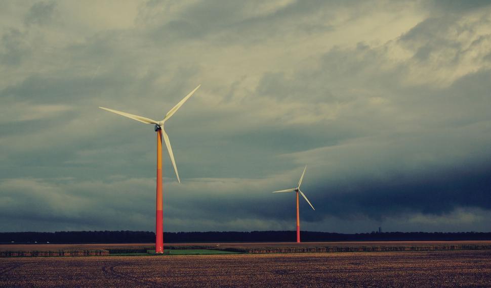 Free Image of Wind turbines under stormy skies 