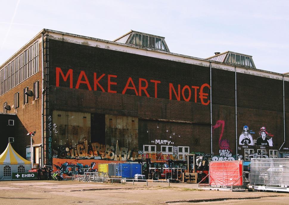 Free Image of Graffiti wall with  MAKE ART NOT 