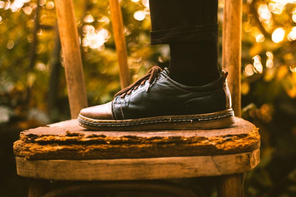 Free Image of Foot on a rusty metallic stool in woods 