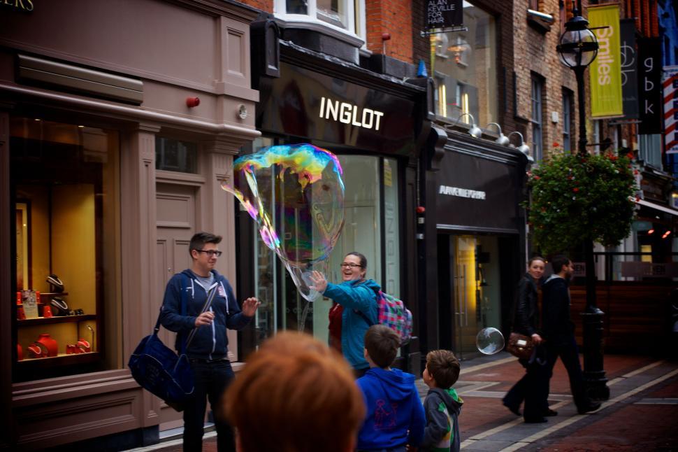 Free Image of People creating giant soap bubbles 