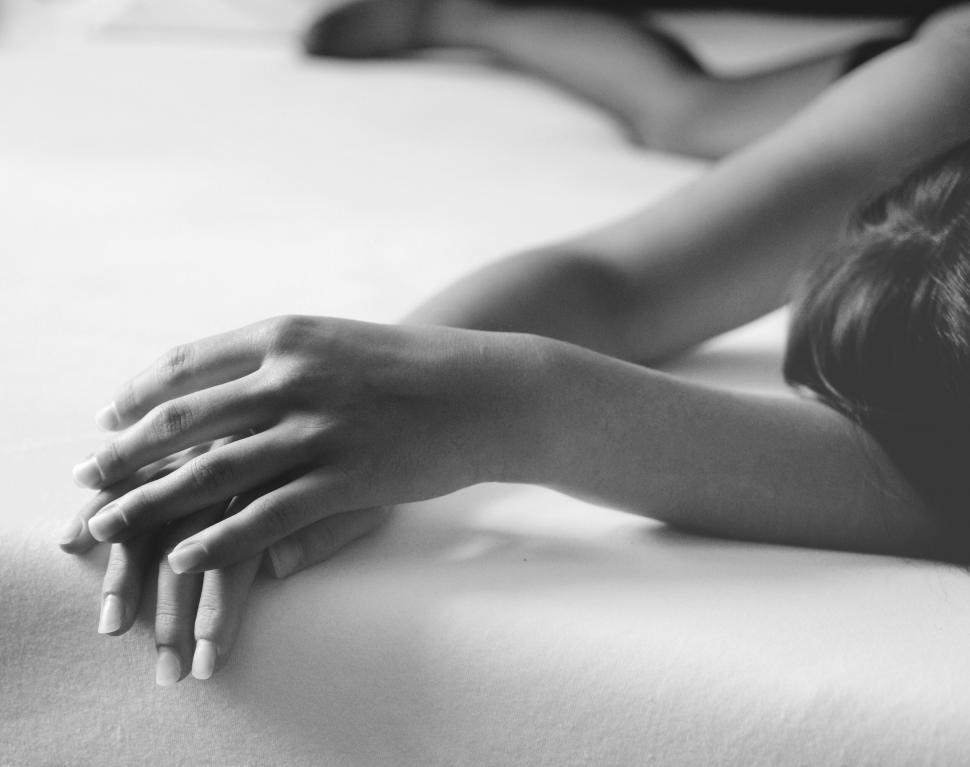 Free Image of Elegant woman s hand on a white sheet 