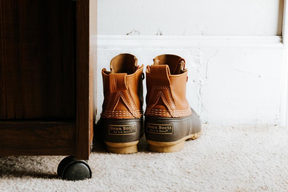 Free Stock Photo of Classic duck boots by the door suggesting outdoor adventure Download Free Images and Free Illustrations