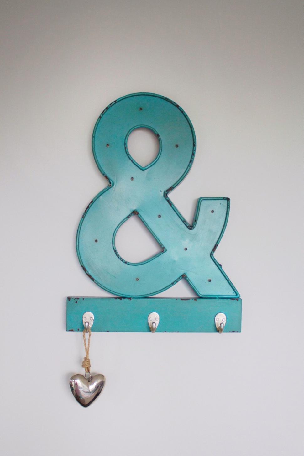 Free Image of Turquoise &amp symbol wall decor with heart 