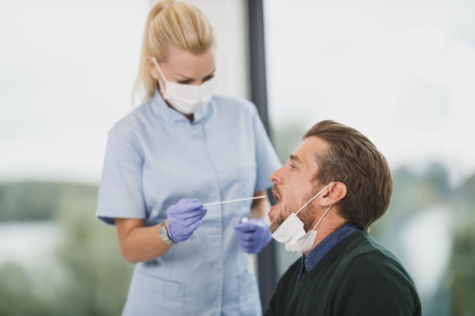 Free Image of Nurse performing a nasal swab test on a patient 
