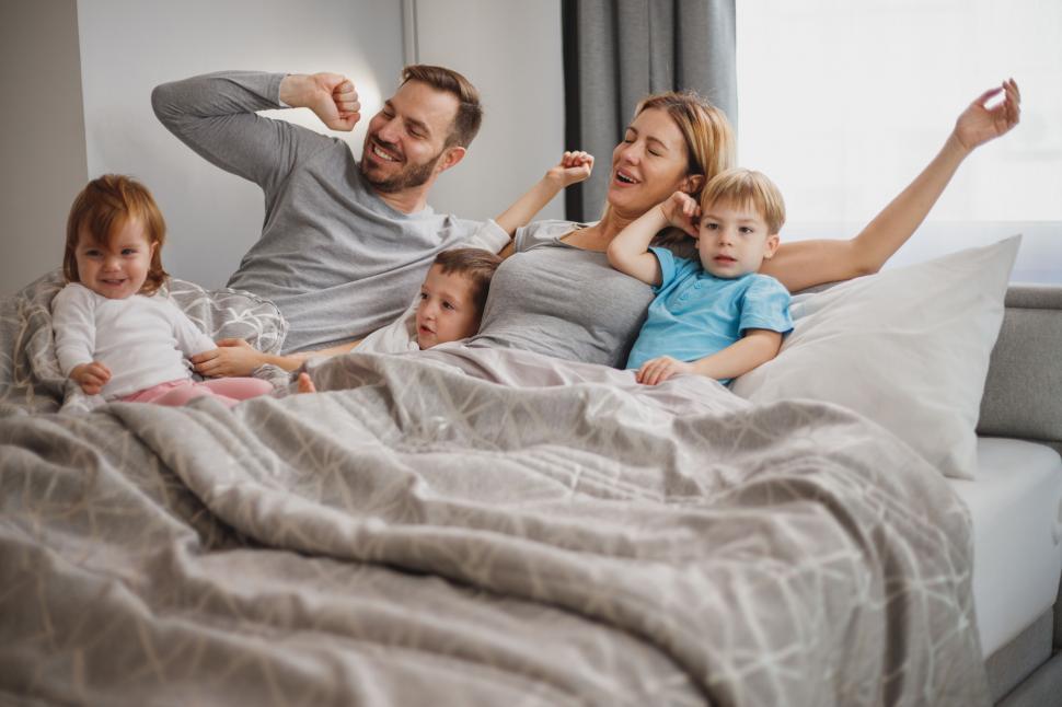 family-having-fun-in-bed-in-the-morning.jpg
