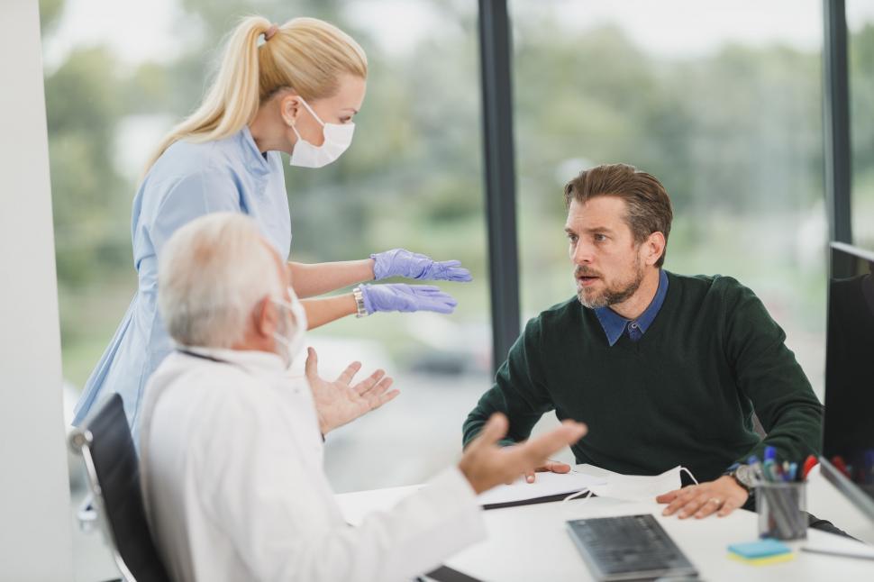 A healthcare professional advising a patient in a clinic setting