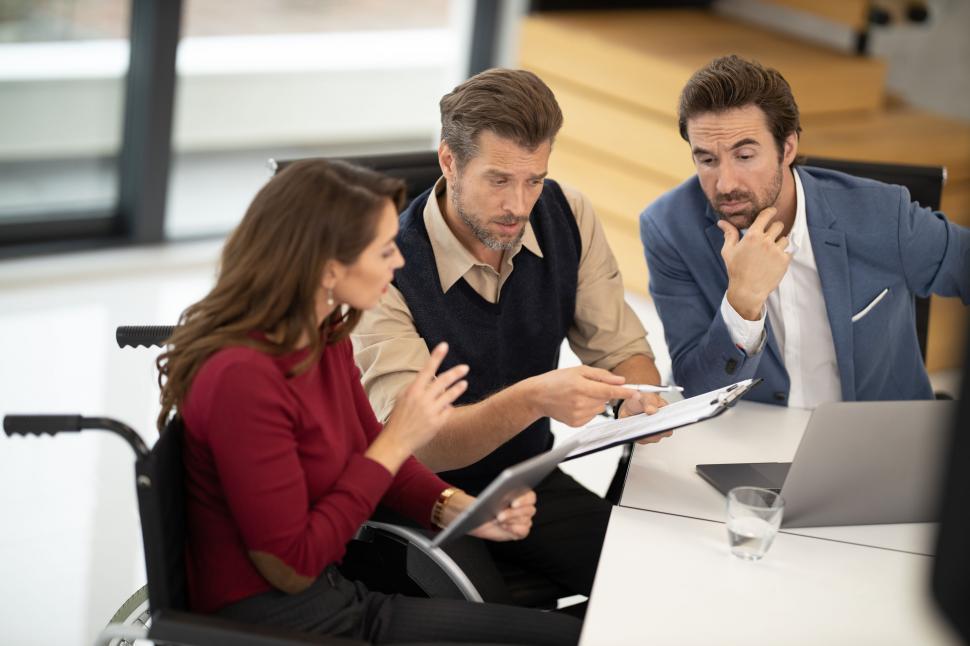 People reviewing sourcing documents