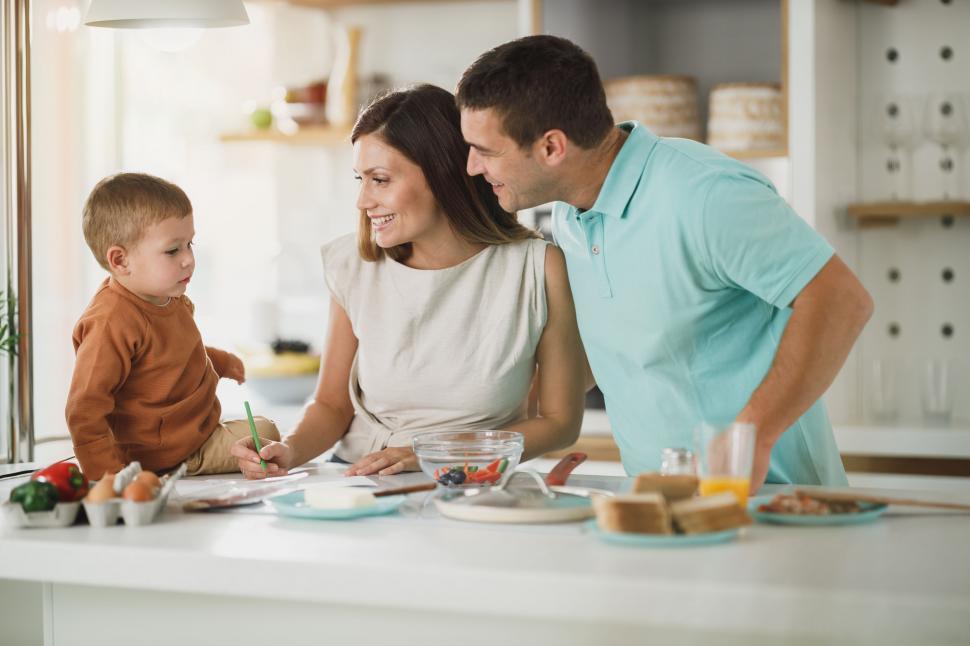 Free Stock Photo of Parents cooking with young son in kitchen ...