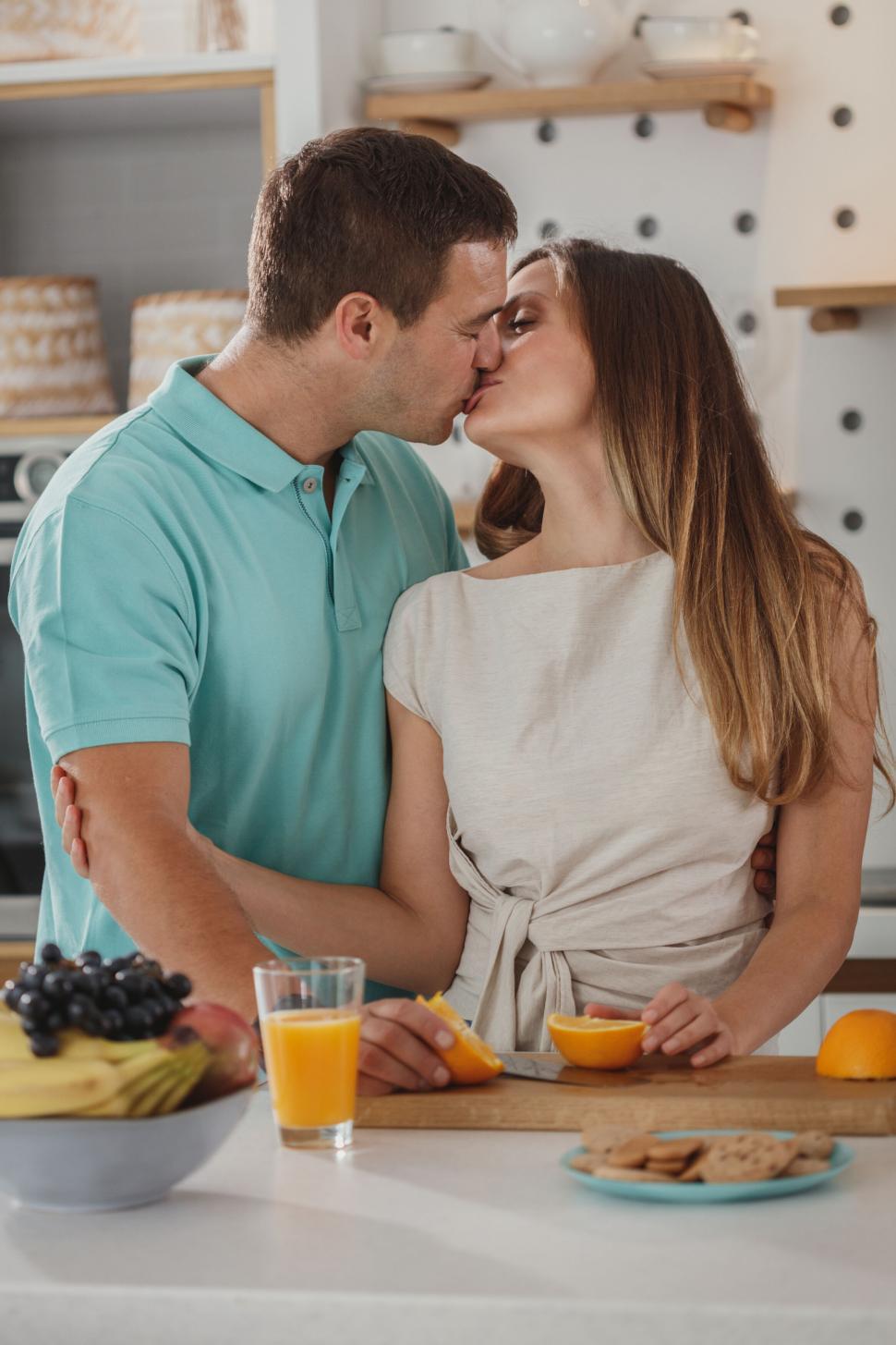 Free Stock Photo of Couple embracing while preparing breakfast | Download  Free Images and Free Illustrations