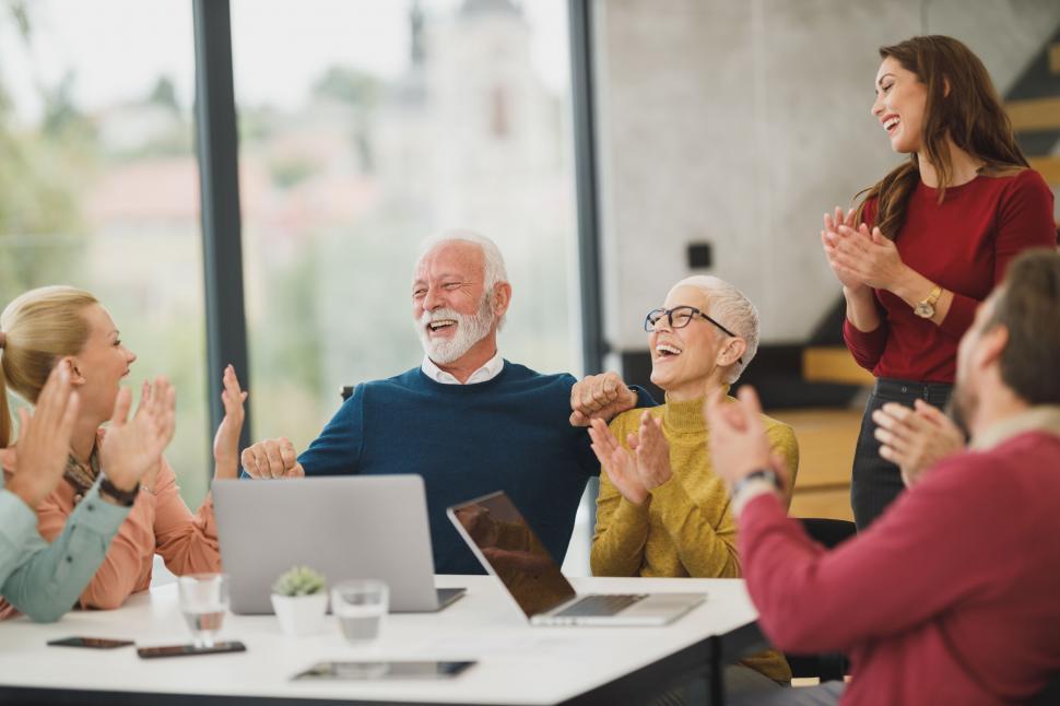 Free Image of Senior businessman celebrated by team 