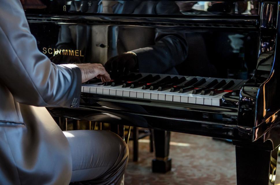 Free Image of Pianist s hands on piano keys 