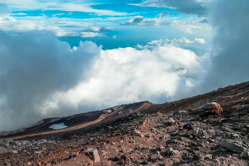 Free Image of Mountain landscape with clouds and rocky terrain 