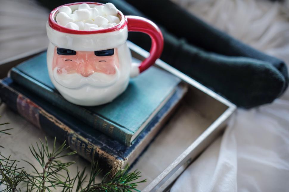 Free Image of Cozy winter moment with books and hot drink 