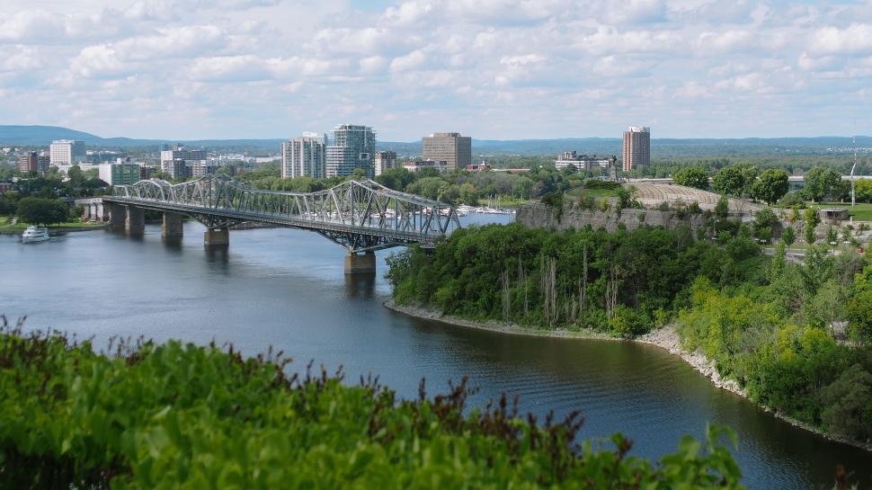 Free Image of River bridge in lush green landscape 