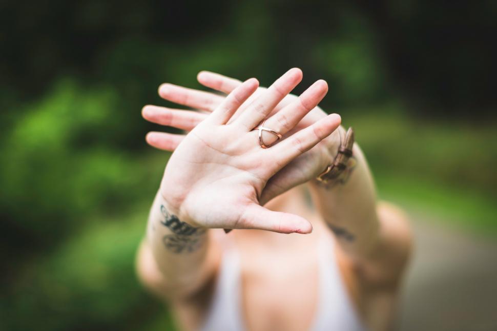 Free Image of Woman holding hands in front of camera 
