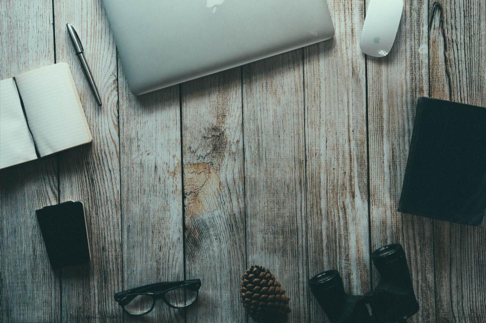 Free Image of Laptop and stationary on rustic wooden desk 