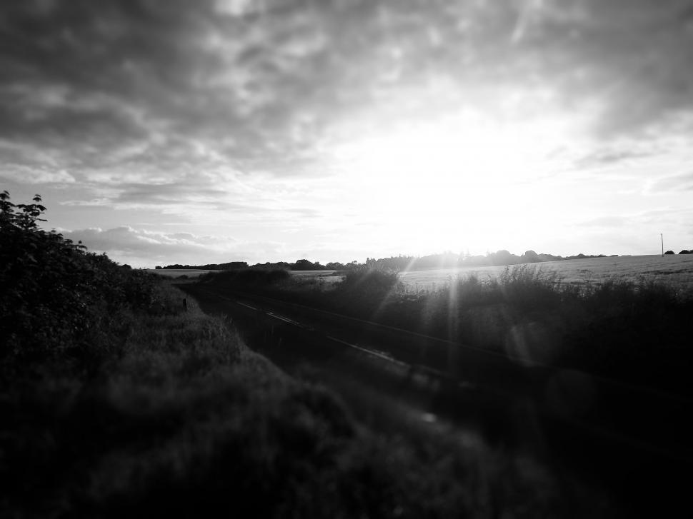 Free Image of Black and white landscape with setting sun 
