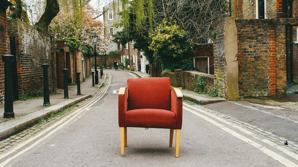 Free Image of Red armchair in the middle of a street 