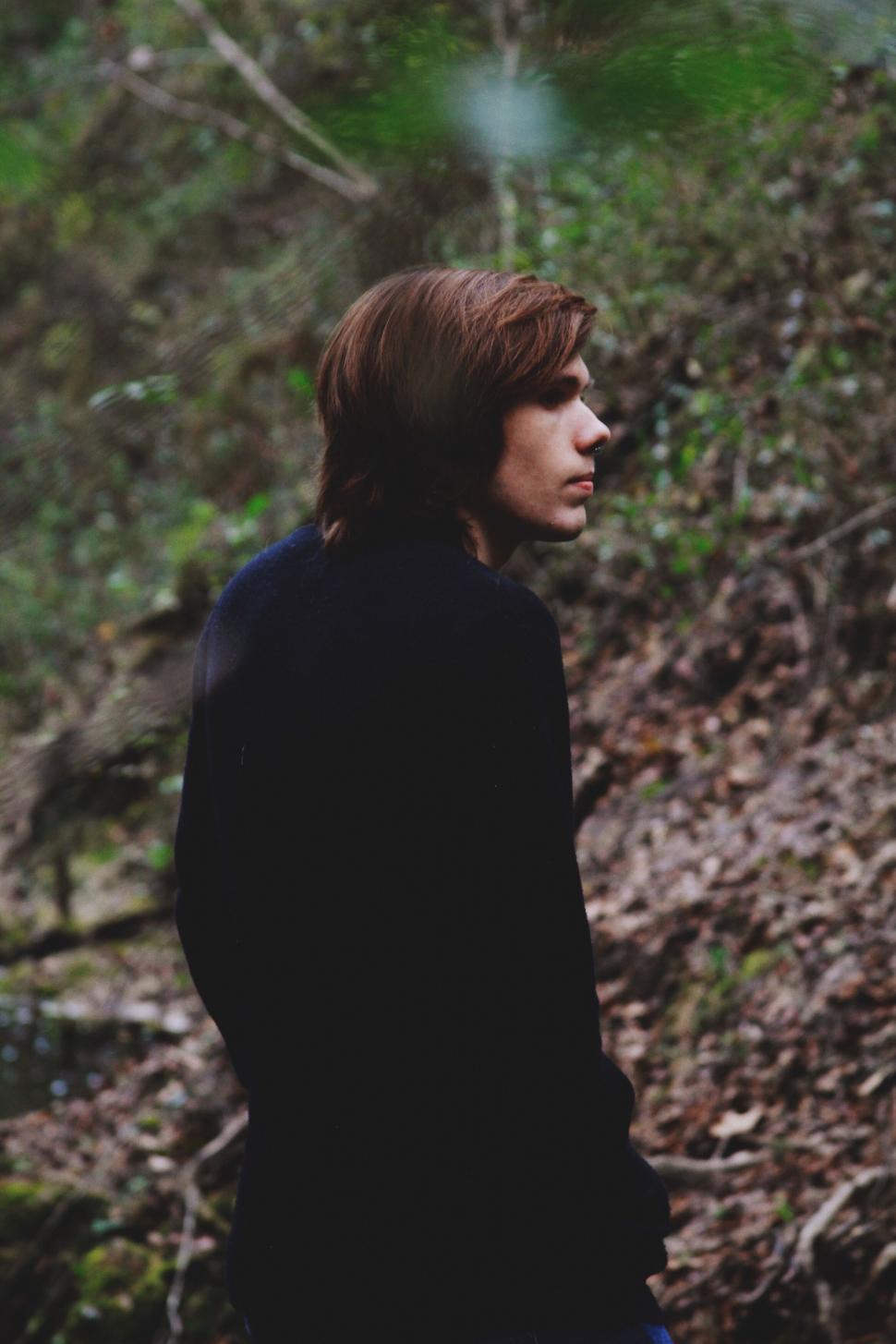 Free Image of Back view of a person in the woods 