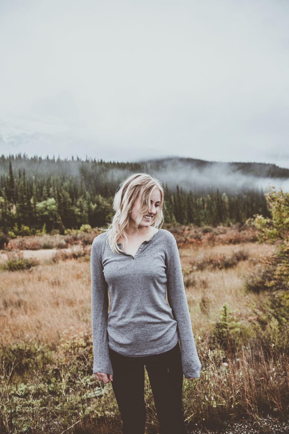 Free Image of Misty mountains and autumn colors with a person 