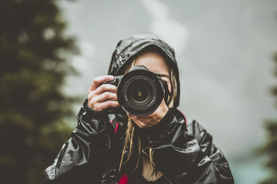 Free Image of Person adjusting headphones in the rain 