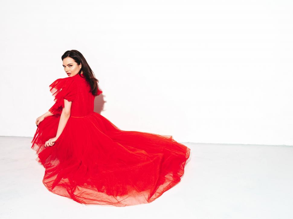 Free Image of A woman in a red dress 