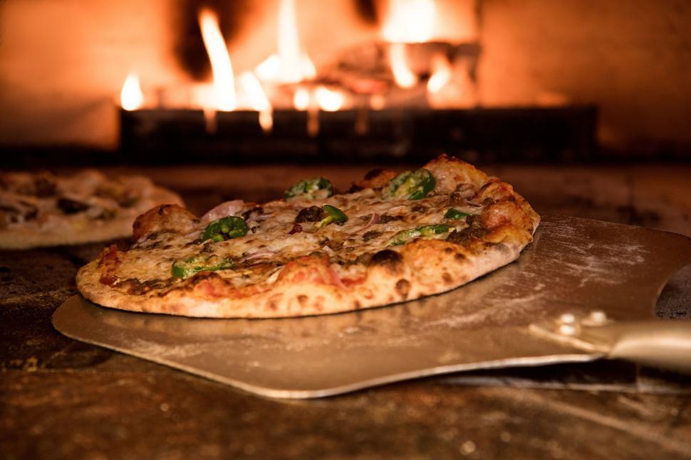 Free Stock Photo Of Fresh Pizza With Toppings In A Fiery Oven 