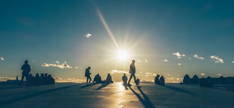 Free Image of Silhouettes against a bright sunset backdrop 