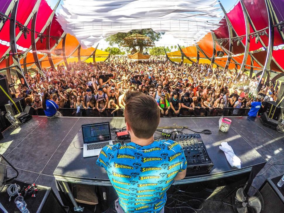 Energetic DJ performing at vibrant festival