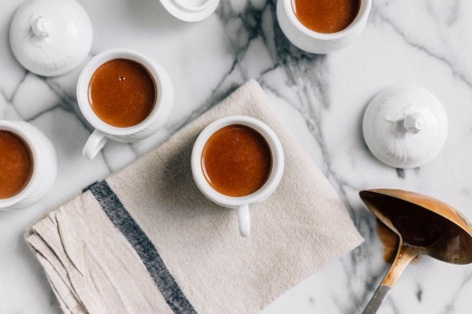 Free Image of Top view of four espresso cups on marble 
