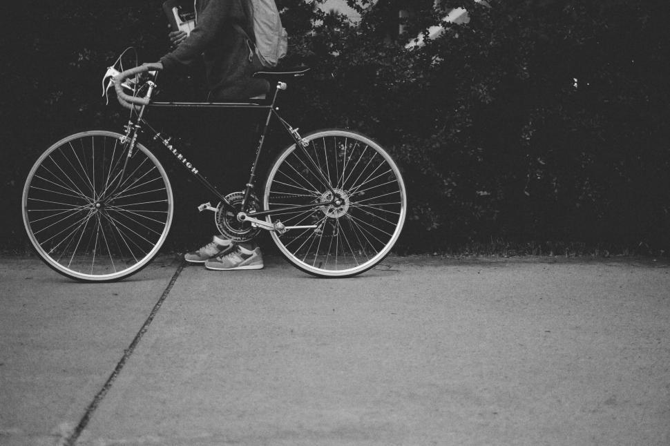 Free Image of Vintage bike and rider on the pavement 