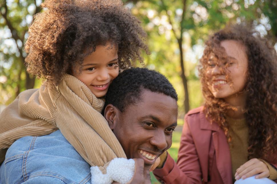 Free Image of Family enjoying autumn outdoors 