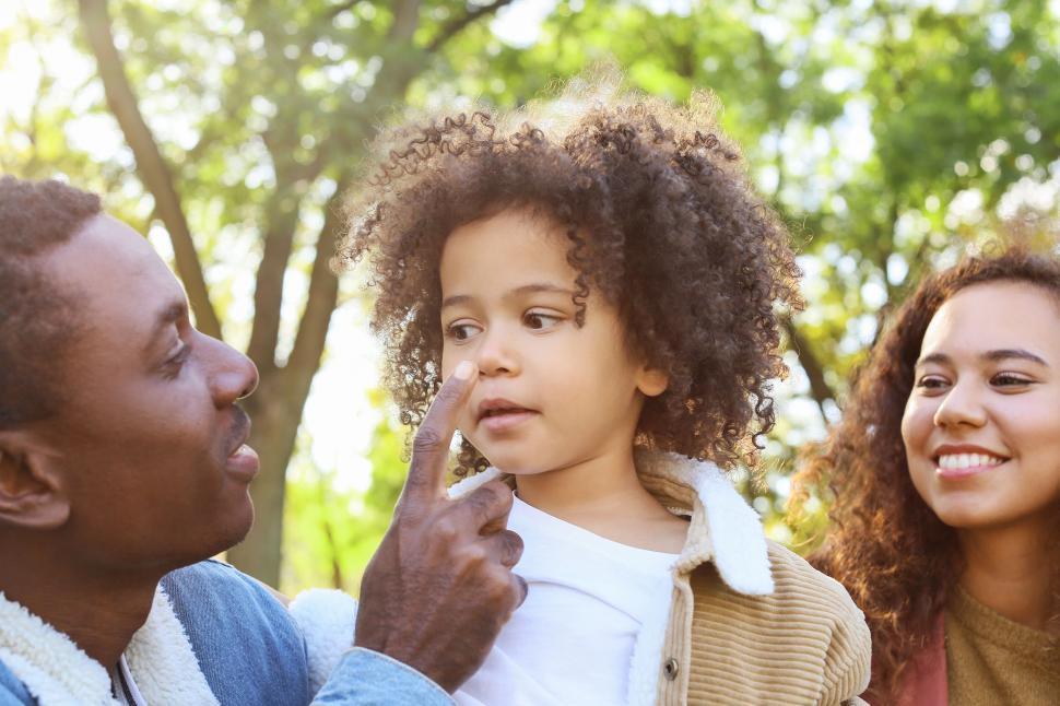 Free Image of Father pointing finger at child s nose 