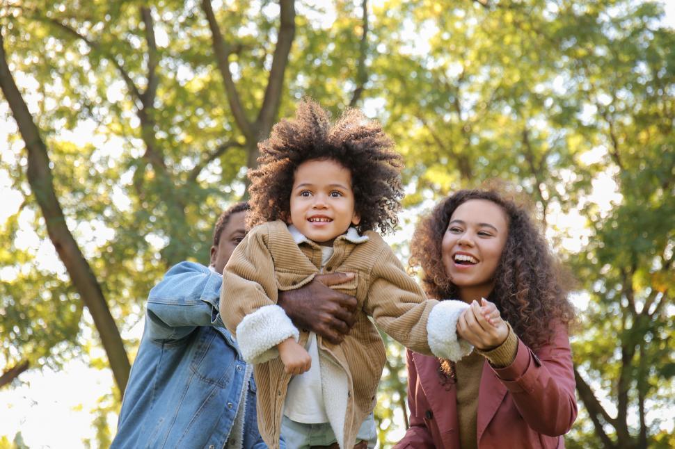Free Image of Playful family time outdoors with autumn vibe 