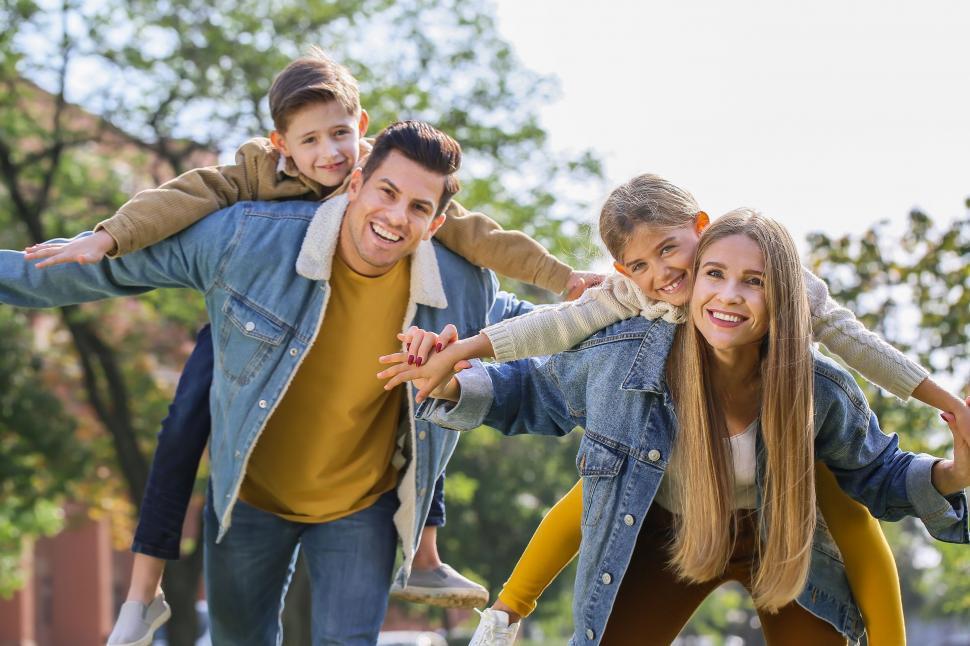 Free Stock Photo of Family giving piggyback rides and smiling ...