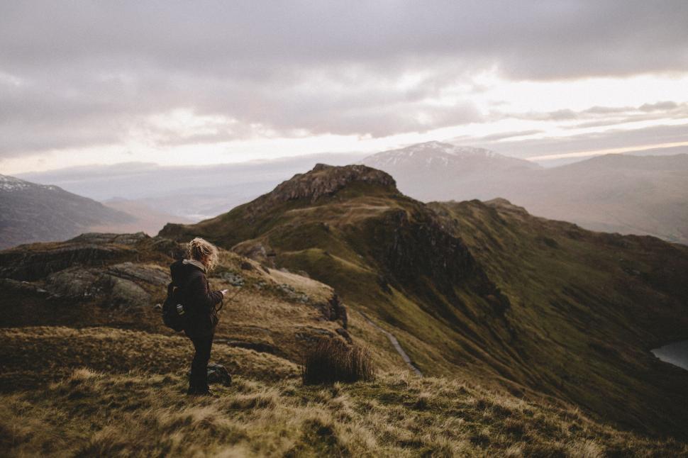 Free Image of Photographer capturing mountain landscape 