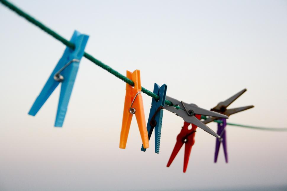 Free Image of Colorful clothespins on a washing line 