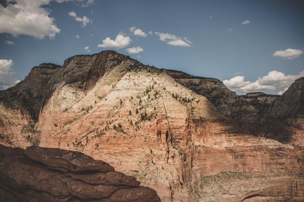 Free Image of Rocky desert cliffs under blue skies 